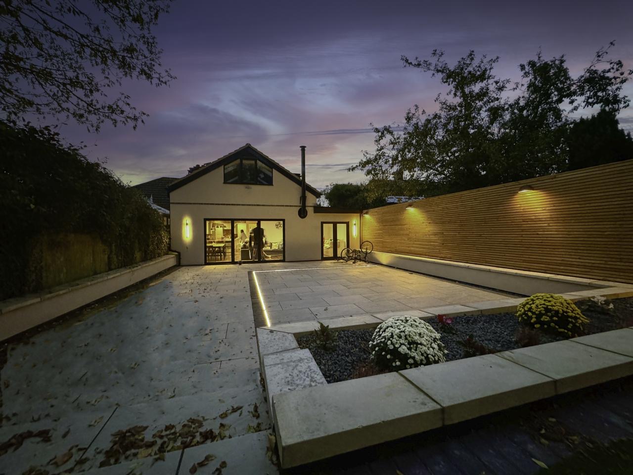 Horton home and landscaped garden at dusk