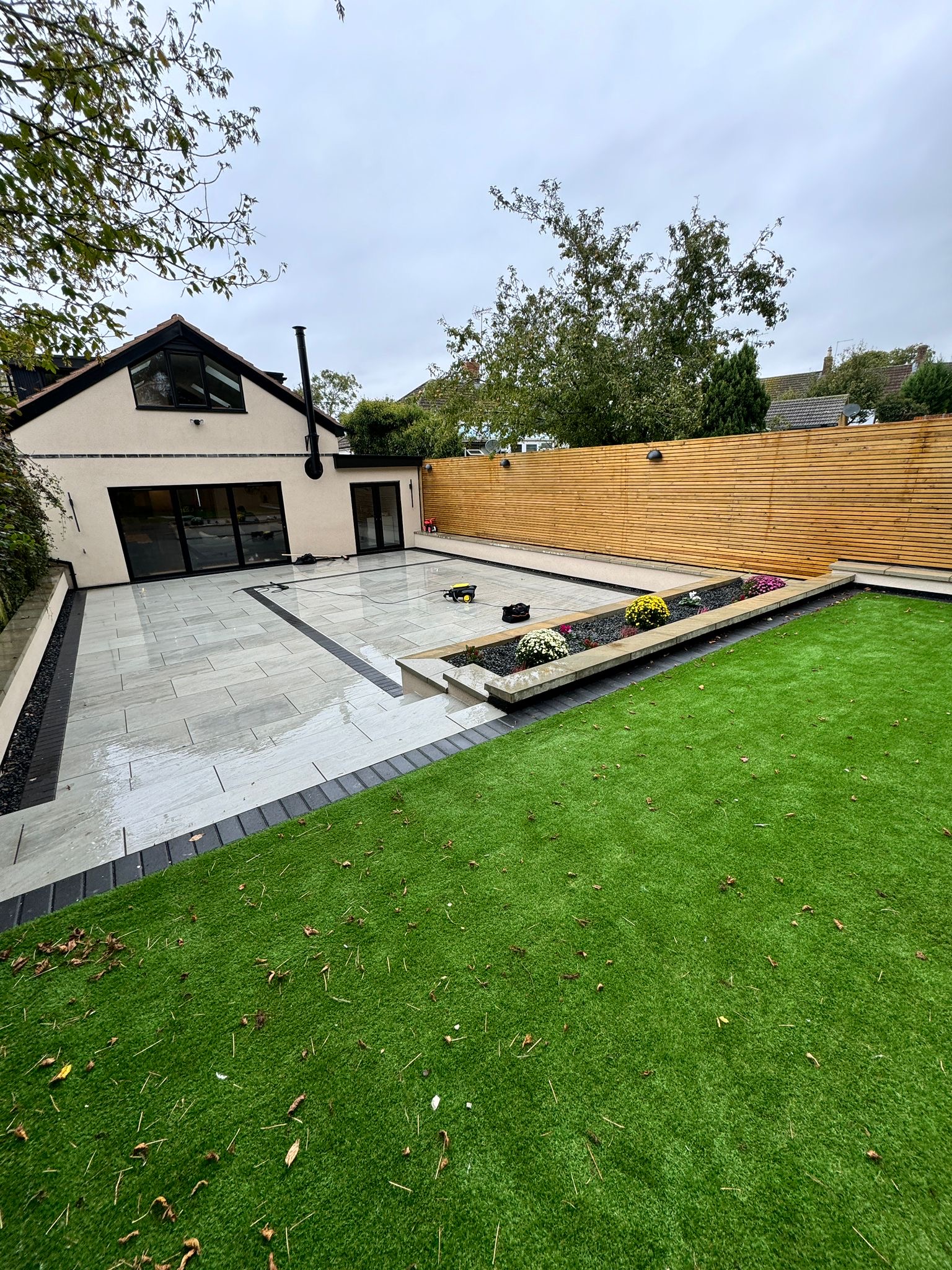 Completed · The house and garden by day