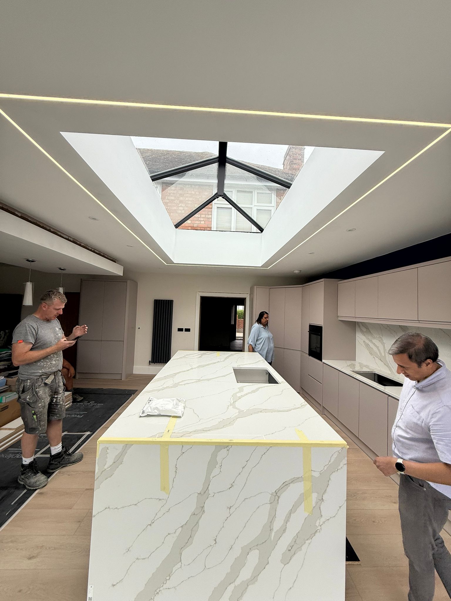 During · Installation of the quartz waterfall island